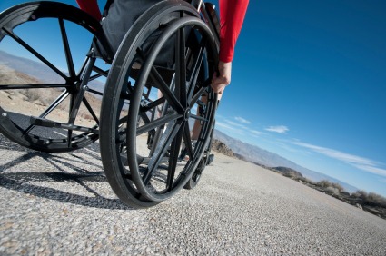 Manual wheelchair with user on smooth road