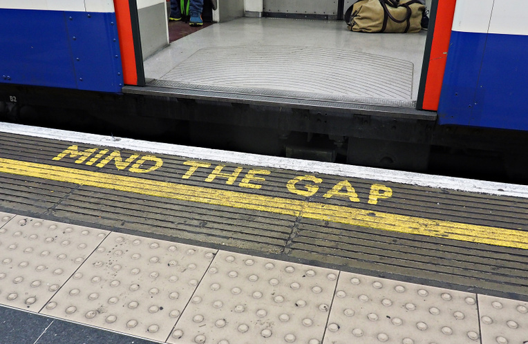Mind the Gap sign on a platform at a London tube station
