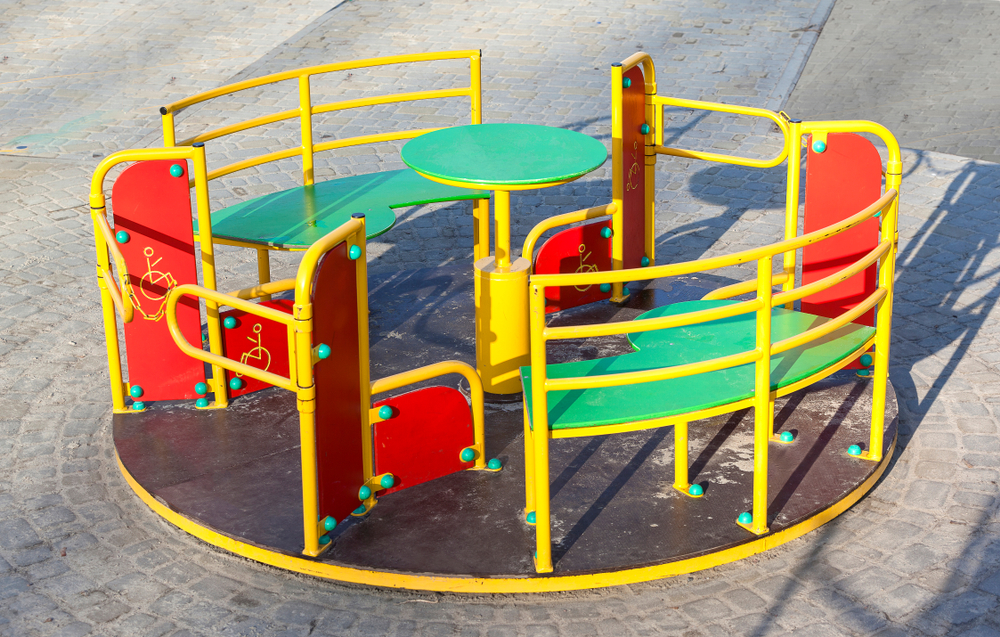 Carousel for with wheelchair access in an inclusive playground