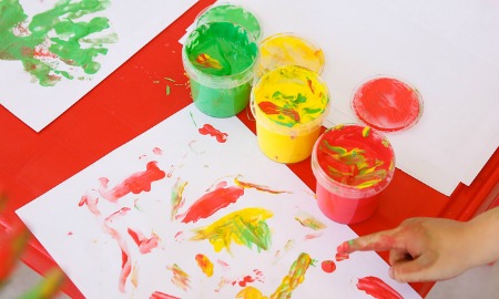 child finger painting