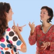 Two deaf women talking in sign language