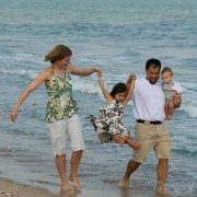 Family at the seaside splashing in the sea