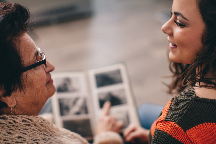 Look at old photographs or create a memory book