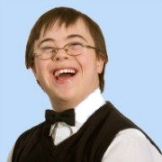 young man with Downs Syndrome dressed in waistcoat and bowtie